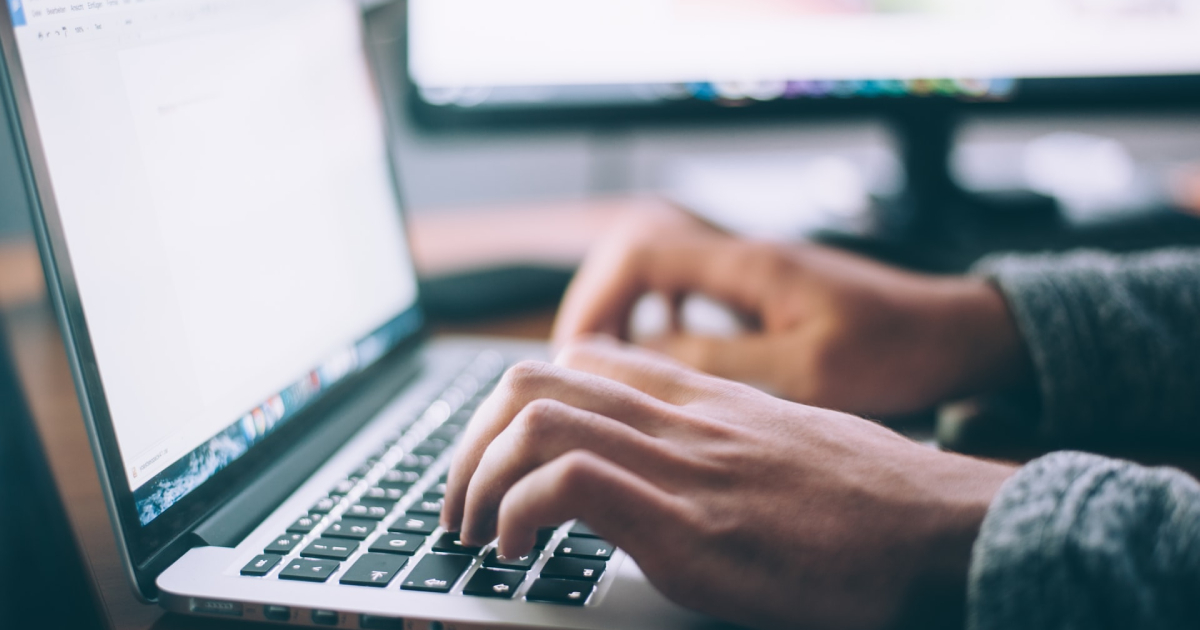 Person typing on a laptop