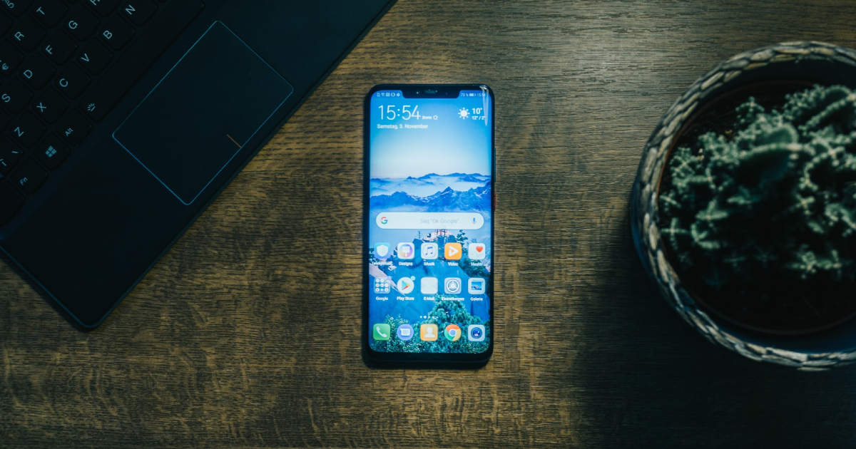 Android smartphone on a wooden desk