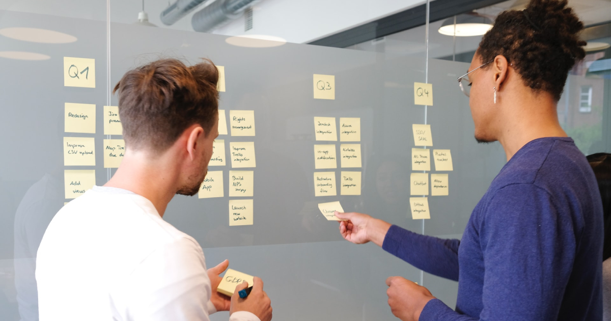 Man putting sticky note