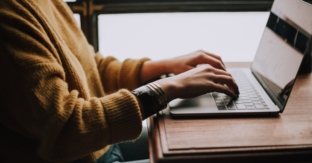 Woman typing on laptop