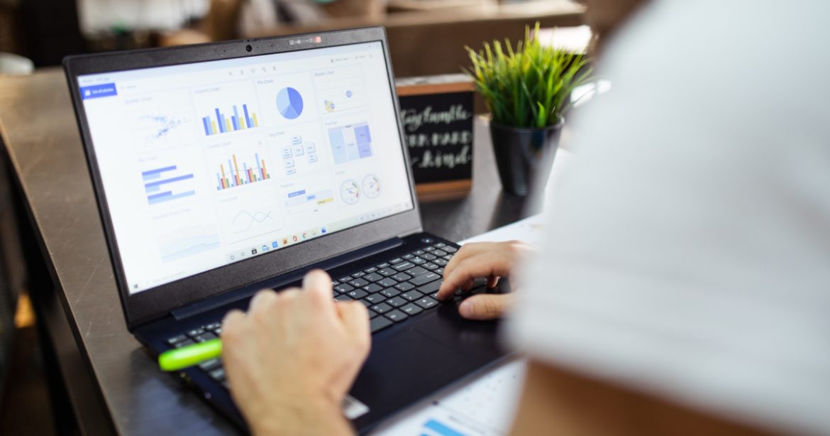 Laptop displaying financial charts Laptop displaying financial charts