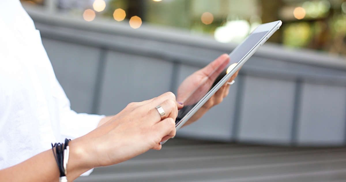 Person touching tablet