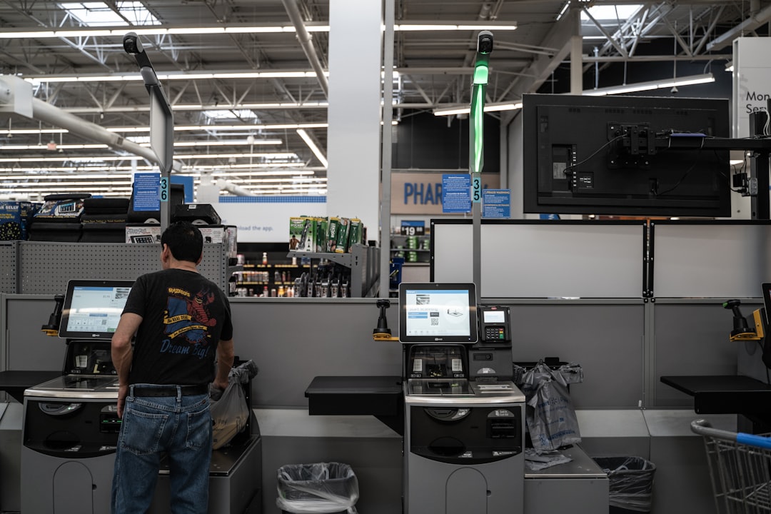 a person standing in a room with computers and other equipment automation, ai technology, efficiency