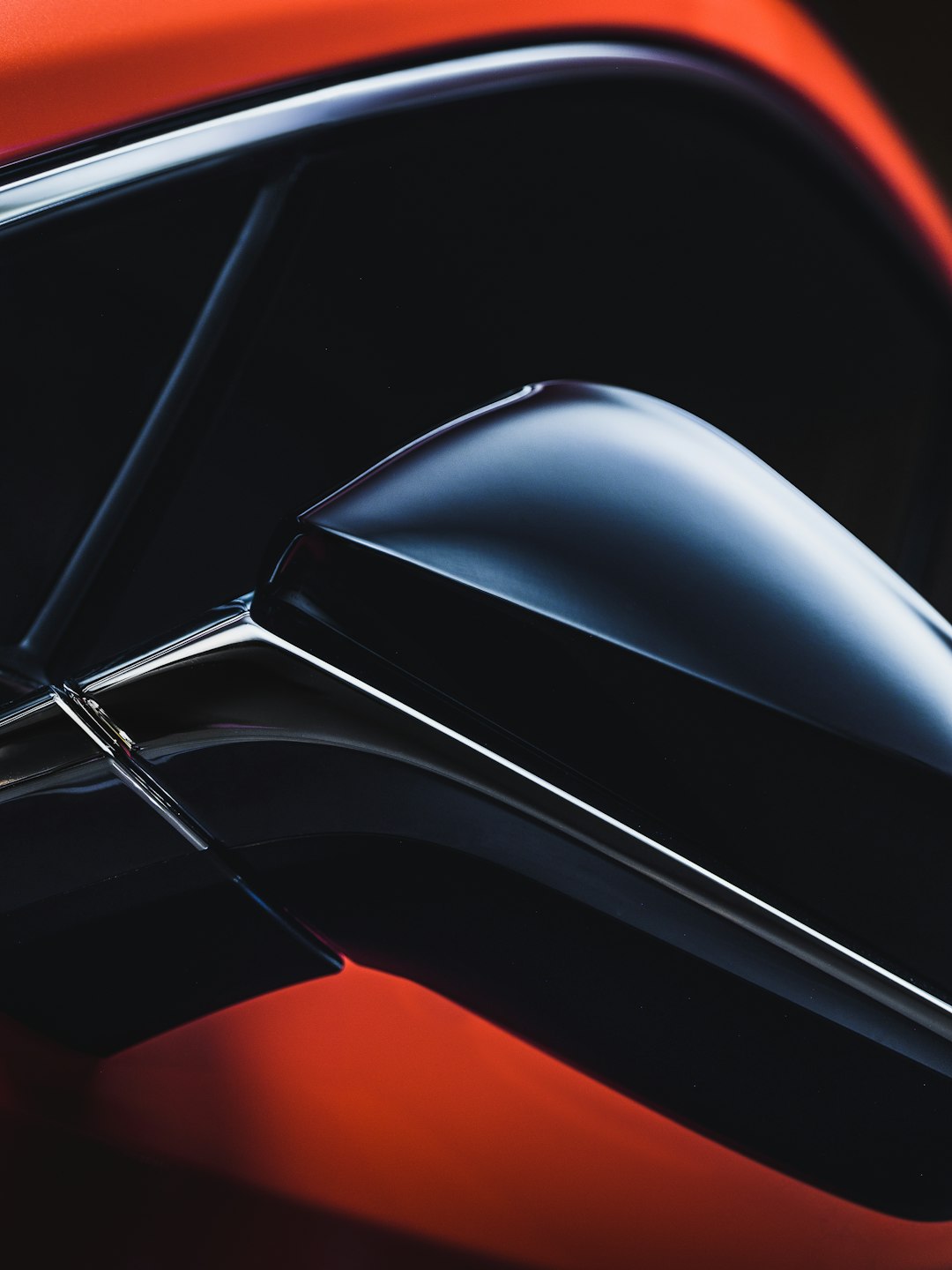 the side view mirror of a red car chrome browser settings passwords