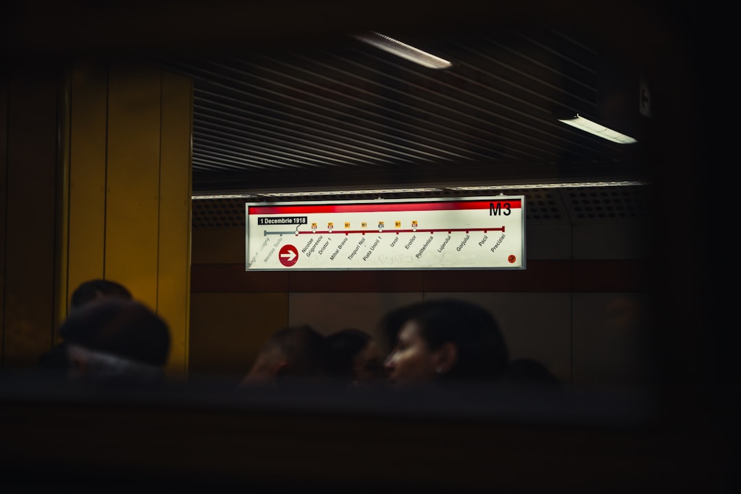 A group of people sitting in a train car people data computer ads