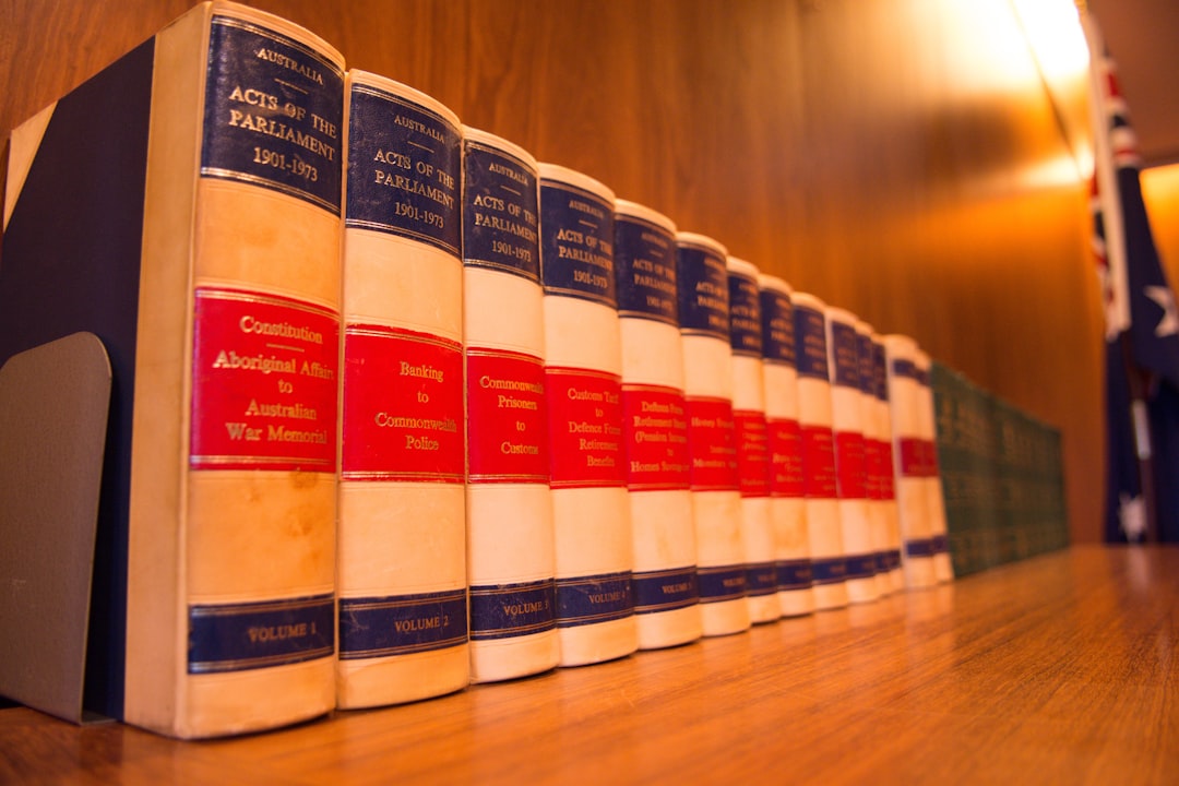 a row of books on a table law firm name, license certificate, legal documents