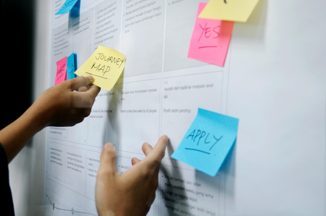 person holding yellow sticky notes launch roadmap, product timeline, marketing plan