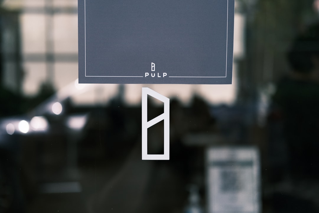 a close up of a sign on a glass door tivimate, onn device, iptv interface