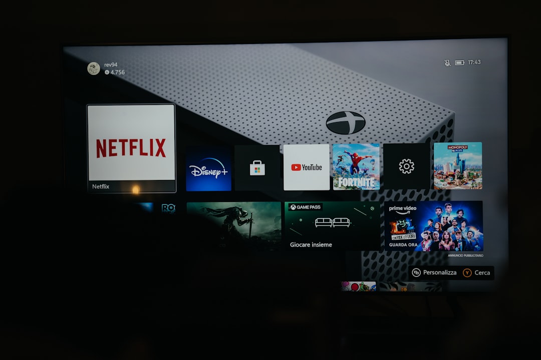 a flat screen tv with a bunch of movies on it roku tv, loading error, smart tv interface