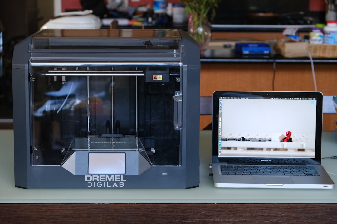 silver macbook pro on white table cmyk printing, color layers, print process