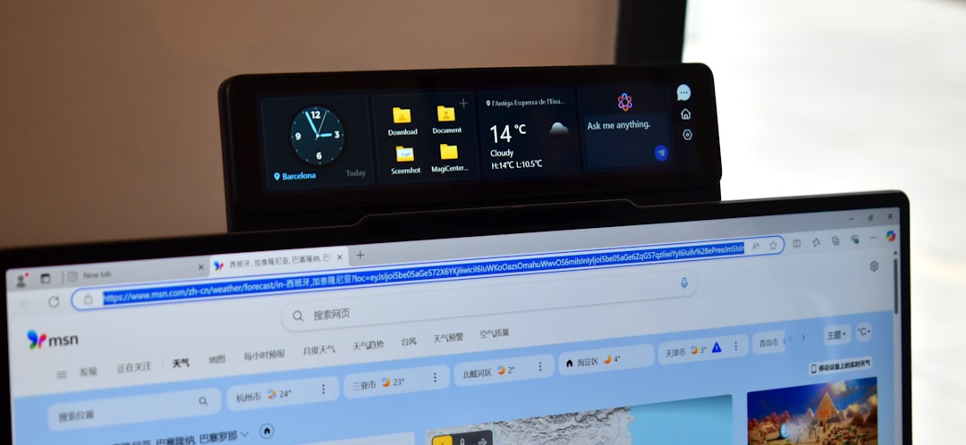 Digital display shows clock, folders, and weather. video streaming dashboard analytics laptop modern office