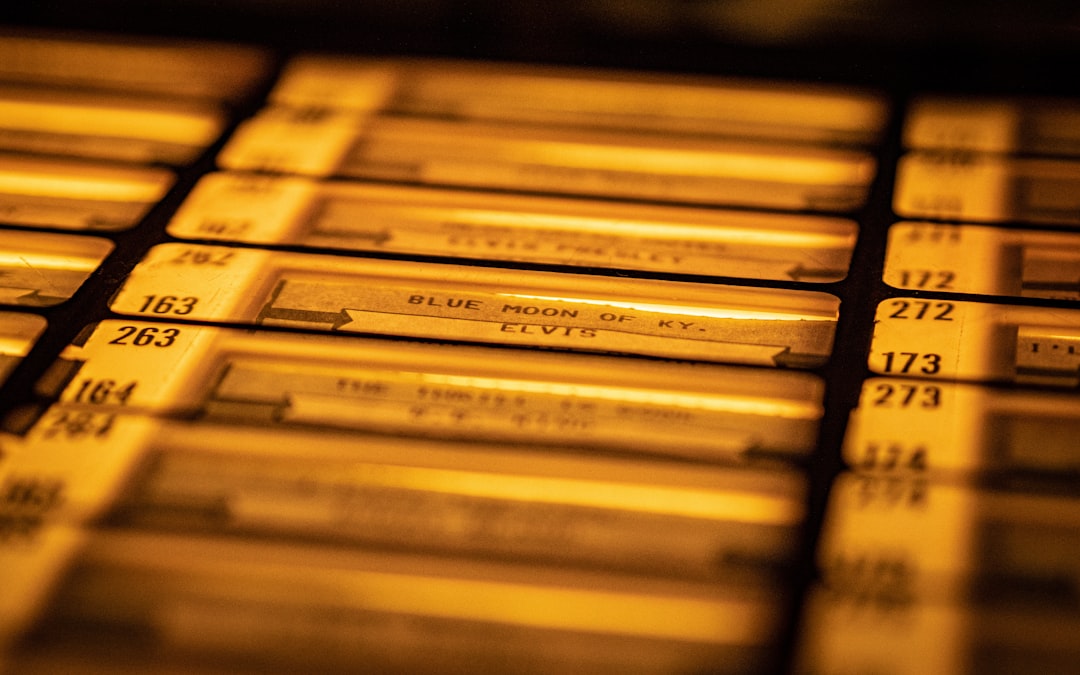 a close up of a bunch of yellow labels antiques database dashboard, collection management software screen, laptop spreadsheet catalog